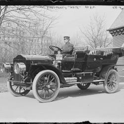 This image from March 1, 1909 depicts the White Model M Steamer purchased for President William Howard Taft outside of the White House garage. The man in the photograph is believed to be chauffeur George H. Robinson.