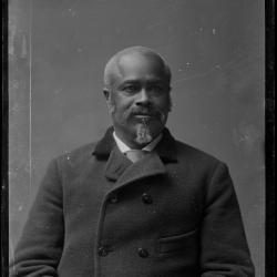 This portrait photograph is of White House staff member Jeremiah "Jerry" Smith. Smith started working at the White House during the Ulysses S. Grant administration in the late 1860s, and served as butler, cook, doorman, and footman until his retirement some 35 years later. Shortly before dying at age 69 in 1904, Smith was visited at his home by President Theodore Roosevelt.